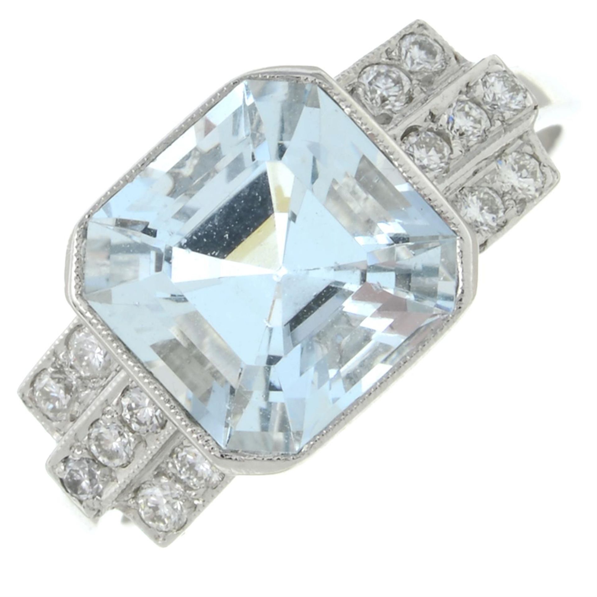 An aquamarine and diamond dress ring.