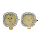 A pair of watch head cufflinks, each with single-cut diamond bezel and onyx crown.