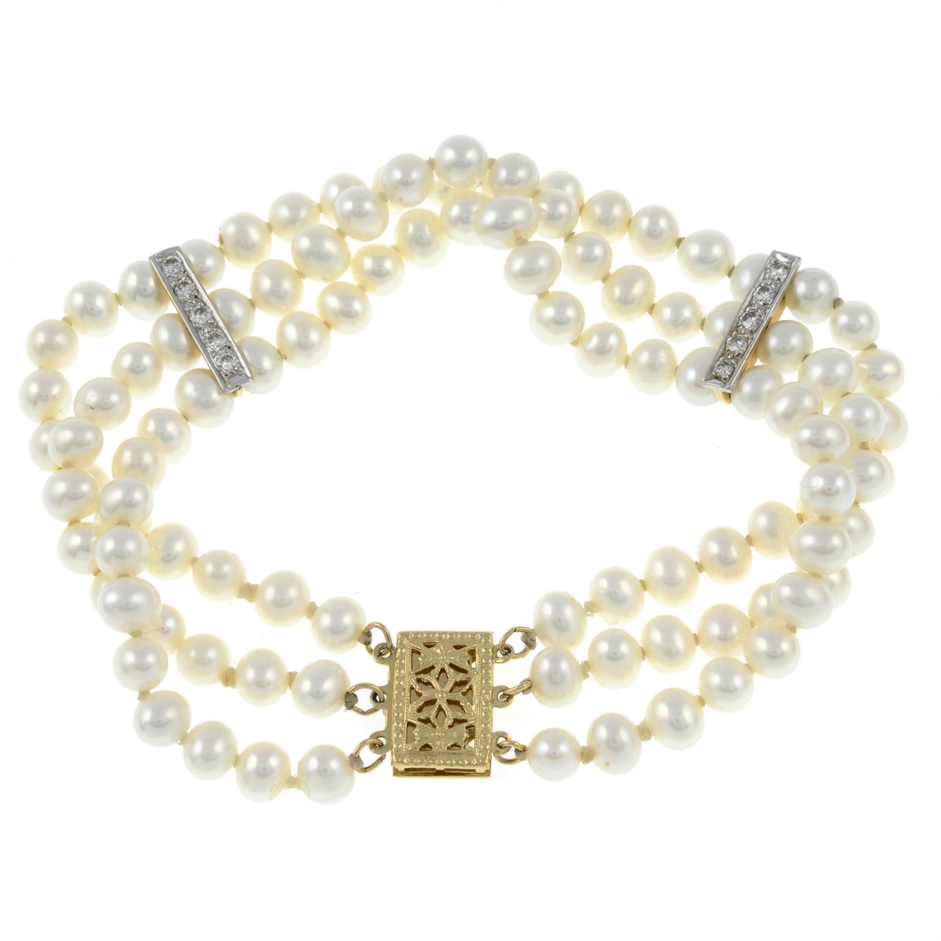A cultured pearl three-row bracelet, with diamond line spacers and openwork clasp. - Image 2 of 3