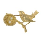 A mid 20th century 9ct gold brooch, depicting a bird standing on a branch, with nest and seed pearl