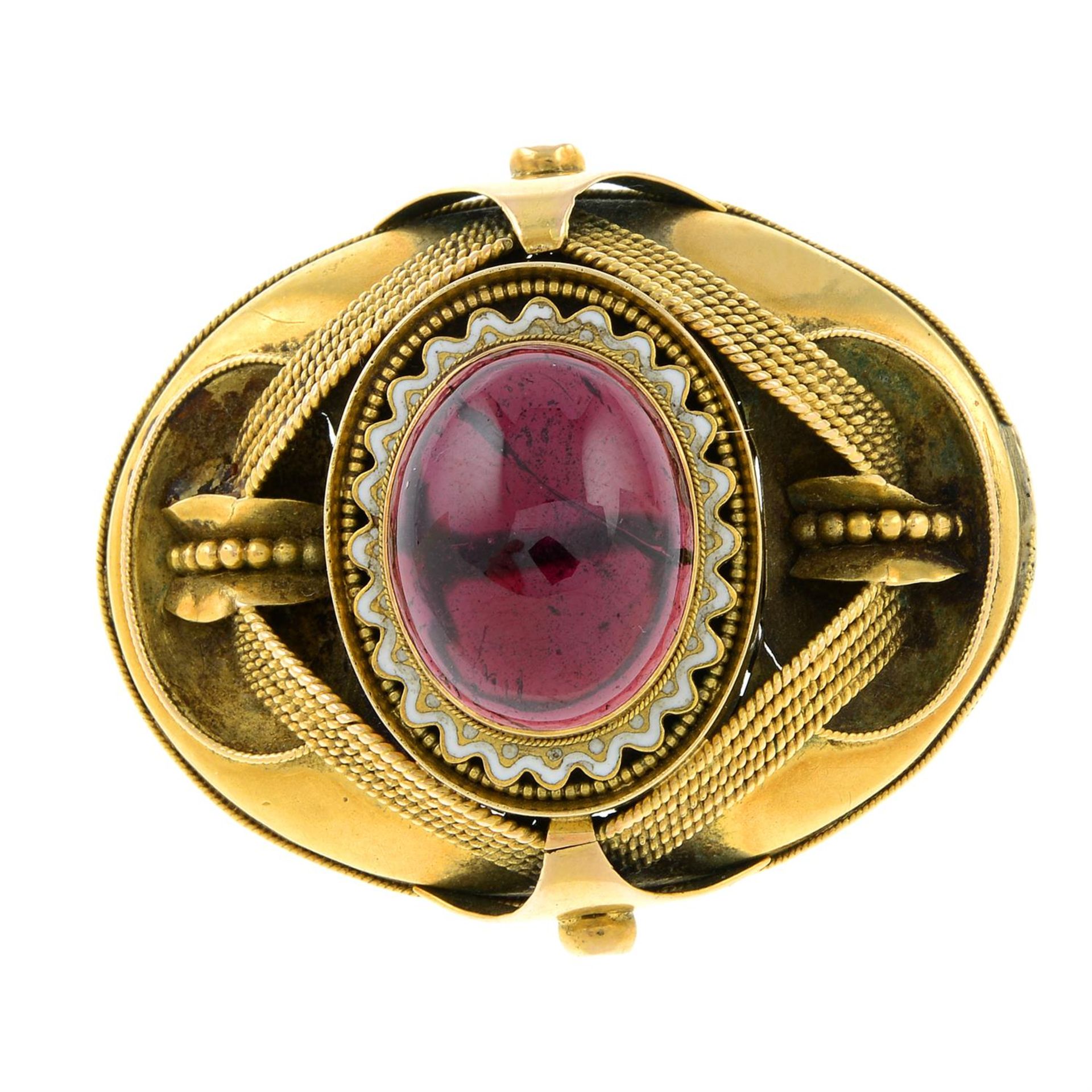 A mid 19th century gold garnet and white enamel brooch.