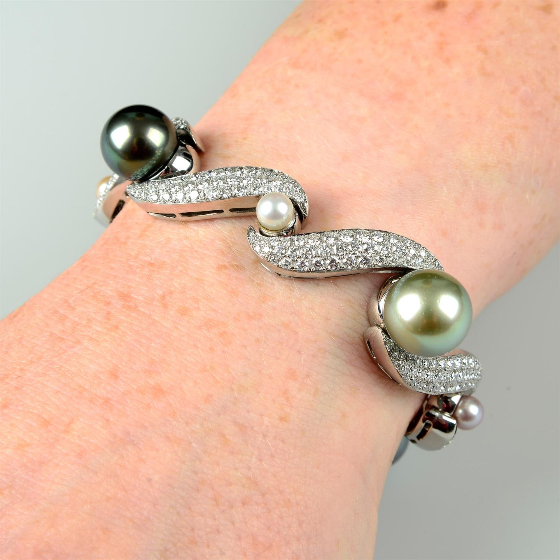 A vari-hue 'South Sea' cultured pearl and pavé-set diamond scroll bracelet, with vari-hue cultured - Image 5 of 5