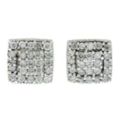 A pair of brilliant-cut diamond cluster earrings.