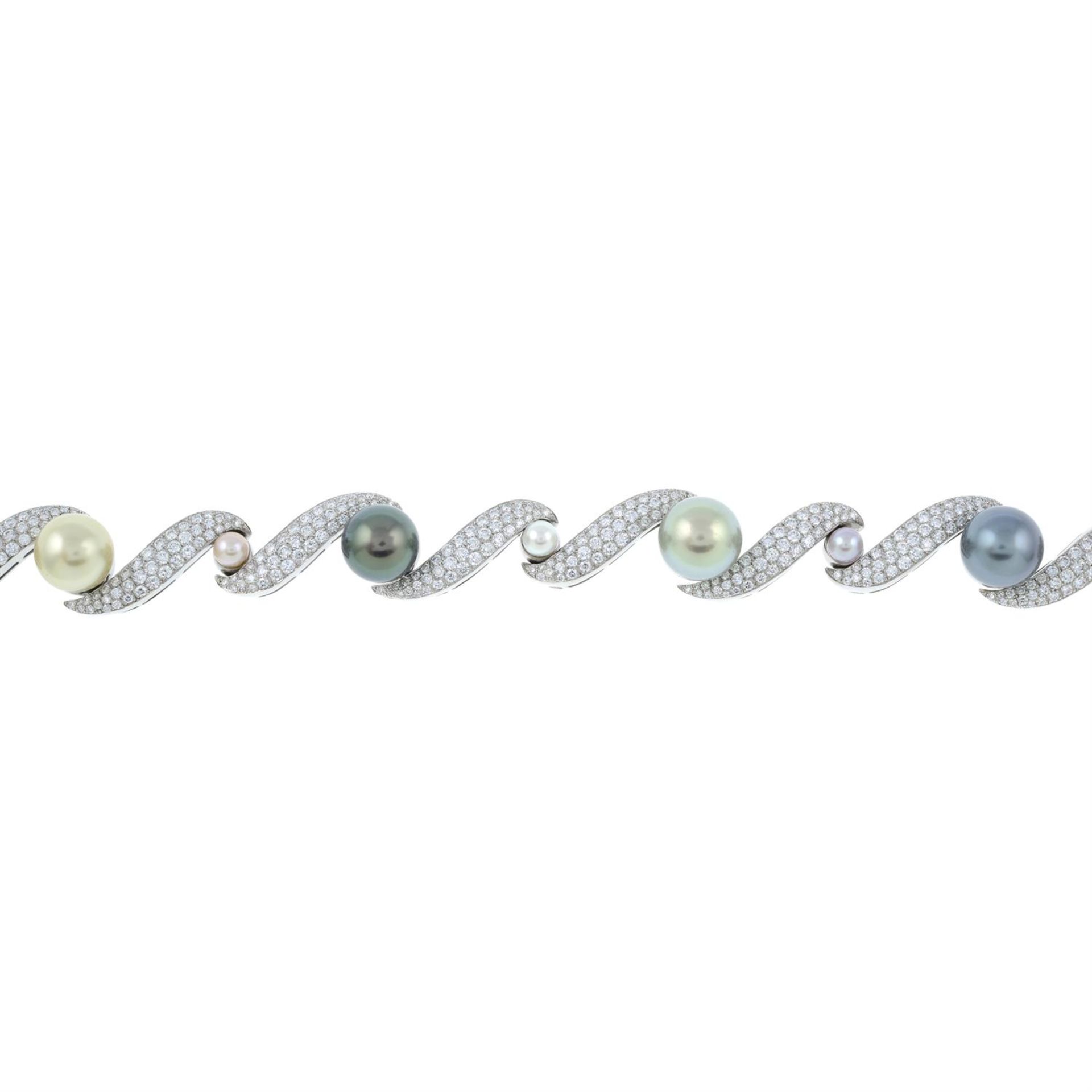 A vari-hue 'South Sea' cultured pearl and pavé-set diamond scroll bracelet, with vari-hue cultured