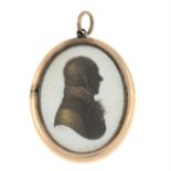 A Georgian painted silhouette portrait miniature locket pendant, with hairwork reverse.