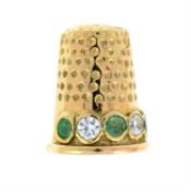 A 9ct gold emerald and cubic zirconia thimble brooch.