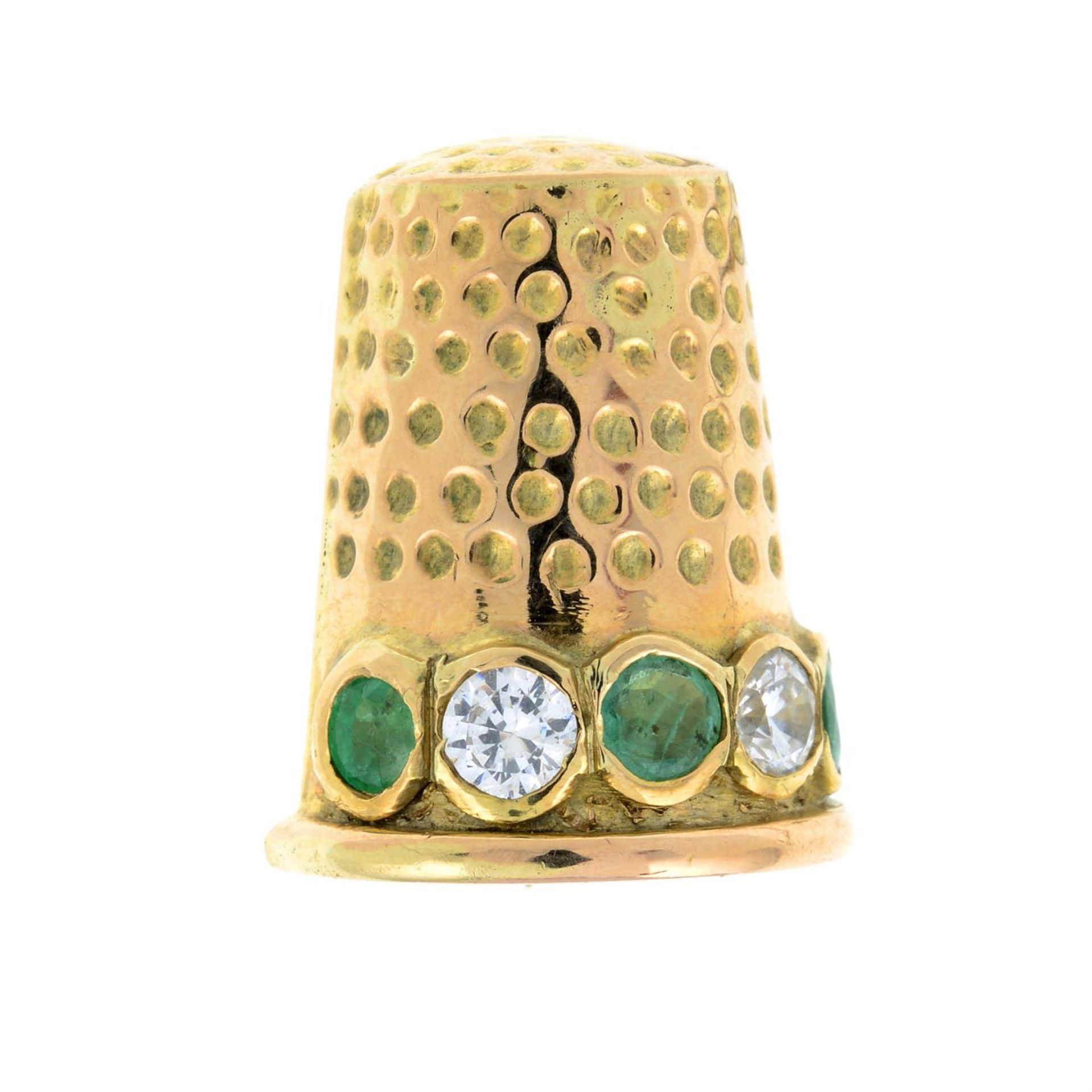 A 9ct gold emerald and cubic zirconia thimble brooch.