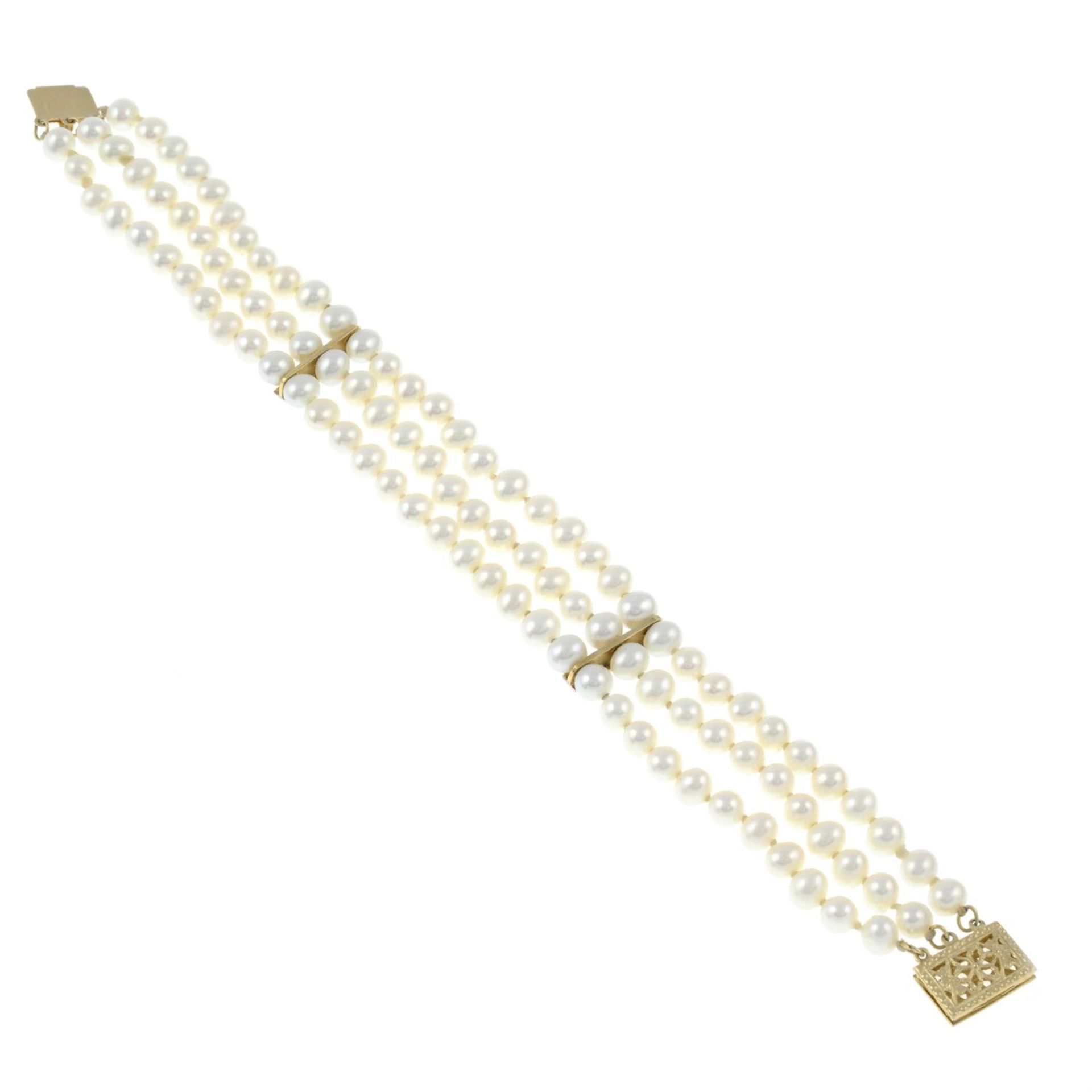 A cultured pearl three-row bracelet, with diamond line spacers and openwork clasp. - Image 3 of 3