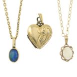 Two opal pendants with chains, and a heart-shaped locket pendant.