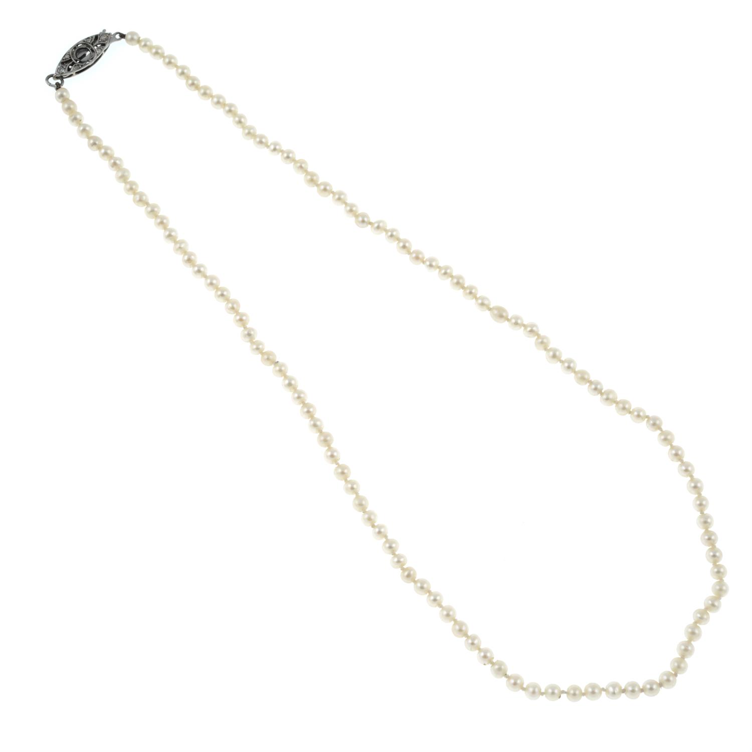 A cultured seed pearl necklace with gold rose-cut diamond clasp. AF.