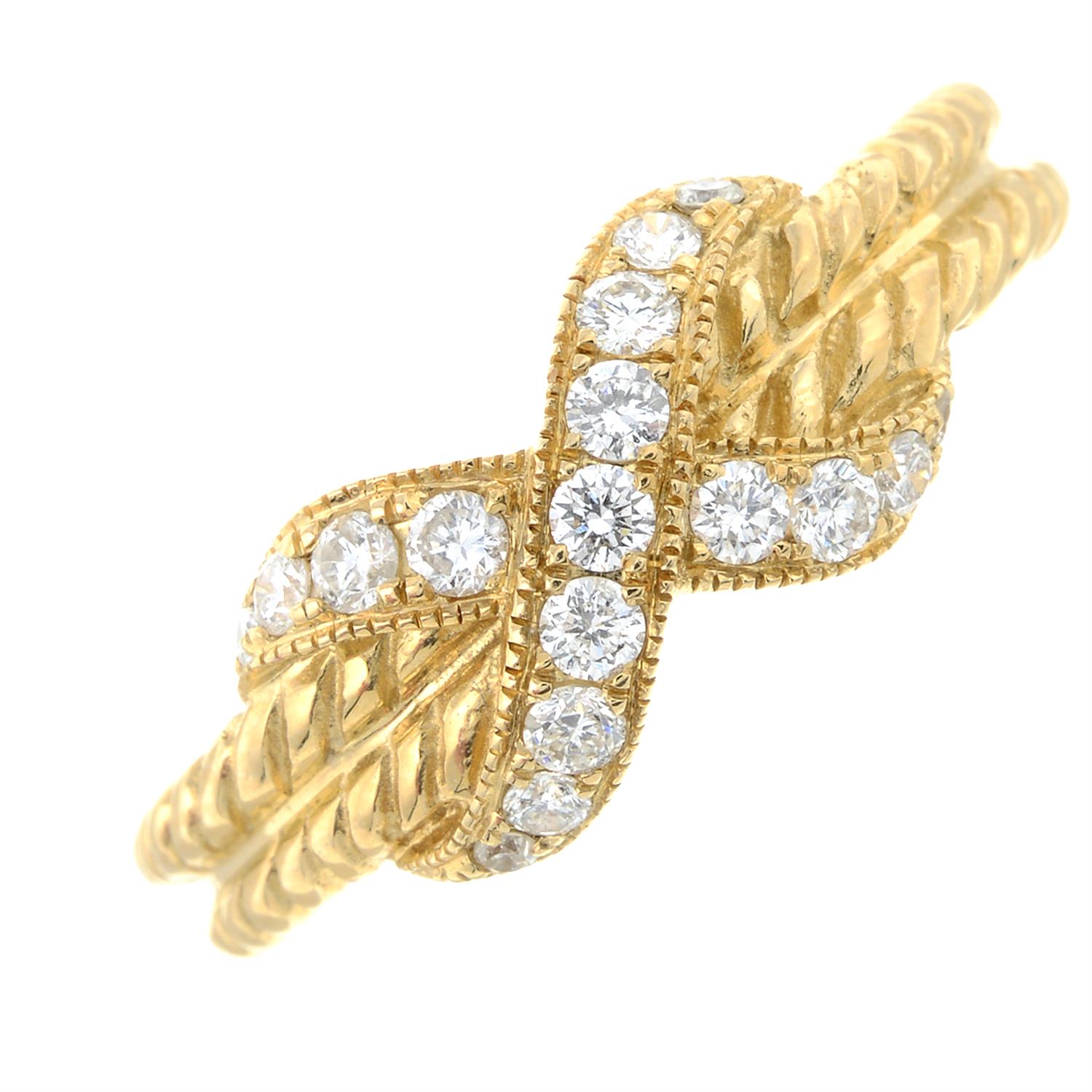 A diamond set dress ring, with rope textured band.