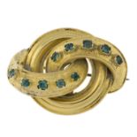 A late Victorian 18ct gold emerald knot brooch.