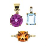 Two 9ct gold topaz pendants, one blue, one purple coated and an orange coated topaz ring.