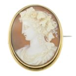 An early 20th century gold carved shell cameo, depicting a Bacchante or Maenad.