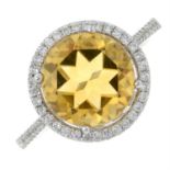 An 18ct gold citrine and diamond cluster ring.