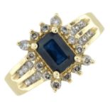 A sapphire and diamond cluster ring, with diamond set shoulders.