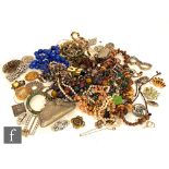 A parcel lot of 19th Century and later costume jewellery to include beads, bangles, brooches, chain,