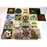 Twelve assorted early 20th Century 6in Art Nouveau dust pressed tiles each with a floral design,