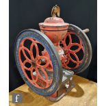 A 19th Century American double fly wheel coffee grinder by Enterprise MFG Co Philadelphia, cast iron