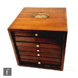 A late 19th to early 20th Century mahogany cube-shaped collector's cabinet, fitted with six