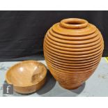 A contemporary treen vase or vessel of ribbed beehive form with lift off open cover, height 45cm and