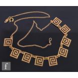 A 14ct necklet with nine Greek key style panels, length 38cm, with a matched pair of earrings, total