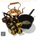 A Victorian copper kettle, a bronzed saucepan, a small swing handled cauldron, a domed wooden hat or