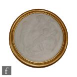 A framed later 20th Century Wedgwood circular plaque depicting in low relief the Madonna and