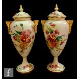 A pair of later 20th Century boxed Royal Worcester blush ivory vase and covers titled Floral Mist