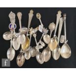 A collection of 20th century commemorative teaspoons some with embossed and engraved bowls each with