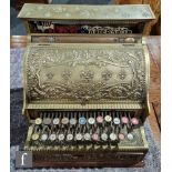 A brass National cash register No 230, serial no 655268, on wooden plinth, width 42cm, A/F.