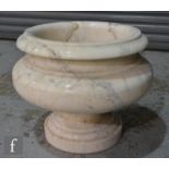 A large contemporary cream veined marble cushion form jardiniere or urn on pedestal base, height