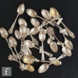 A collection of Victorian and later commemorative silver spoons, all of varying designs with
