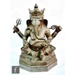 A bronze/copper alloy South Indian/Tibetan figure of Ganesha, the elephant headed god of wisdom,