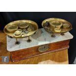 A set of early 20th Century marble topped and line inlaid walnut advertising shop counter scales,