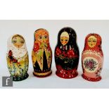 Four later 20th Century Russian Matryoshka dolls, each hand painted with stylised ladies with