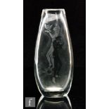 A large post war Peter Dreiser clear crystal glass vase of compressed ovoid form, engraved with