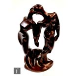 A later 20th Century Austin Sculpture resin moulded abstract figural group, composed of a man and