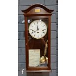 A late 20th Century wall clock by Comitti London in a mahogany glazed case, height 60cm.