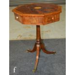 An early 20th Century mahogany occasional drum table of octagonal form, with inlaid central