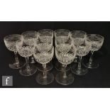 A set of twelve 20th Century Stourbridge wine glasses, each with an ovoid bowl cut with a Celtic