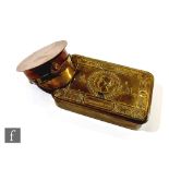 A World War One trench art copper tobacco or snuff box in the form of an officer's cap with brass