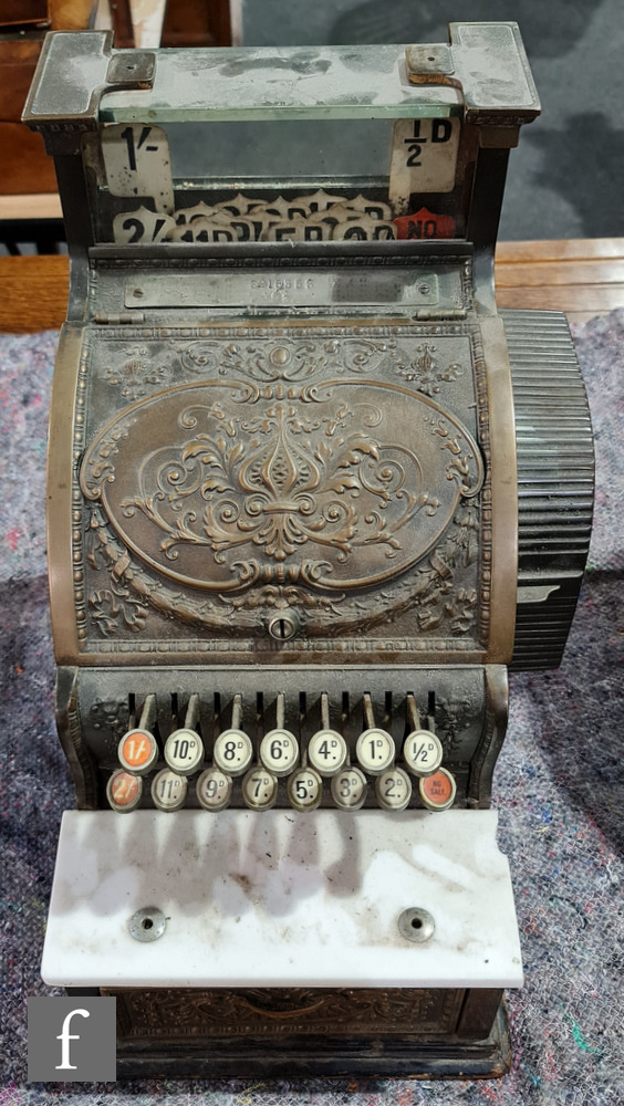 A small brass National cash register, No 46 1/4, serial no 15333, on wooden plinth base, width 29cm.