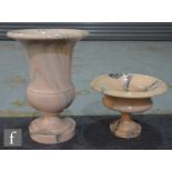 A veined pink campana shape urn, height 40cm, and a similar black veined pedestal vase, height 21cm.