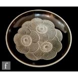 A 1930s French Art Deco pressed glass bowl by Pierre D'Avesn for Veryls, of shallow circular form,