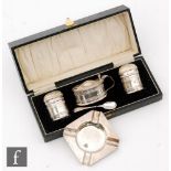 A cased hallmarked silver three piece cruet set of oval form with pierced galleries, with a small