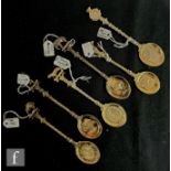 A composed set of six hallmarked silver gilt teaspoons relating to British Territories to include