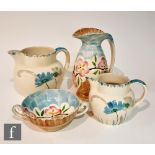 Four pieces of 1930s Art Deco Myott comprising a 'Chicken Neck' jug decorated in the hand painted