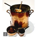 A large 20th Century two handled copper wash tub, six various sized copper iron handled saucepans