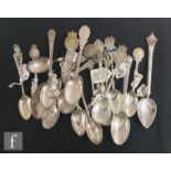 A collection of Victorian and later commemorative silver teaspoons some with engraved bowls and each